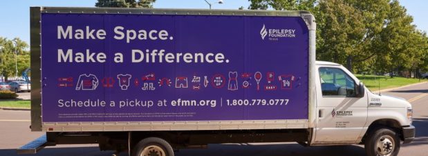 An Epilepsy Foundation used goods donation truck with a purple image saying, "Make Space. Make a Difference."